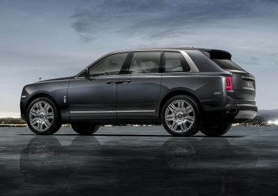 Side profile of luxury SUV with distinctive alloy wheels