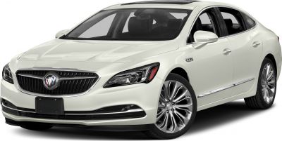 Front view of a white mid-size sedan with LED headlights and alloy wheels
