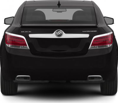 Rear view with distinctive taillights, chrome trunk trim, dual rectangular exhausts