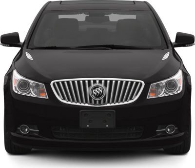 Front view with chrome vertical grille and dual round headlights