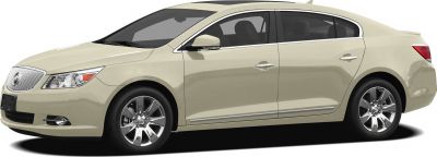 Side profile of beige sedan with chrome wheels and smooth body lines