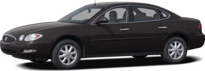 Side profile of a sleek sedan with smooth lines and alloy wheels