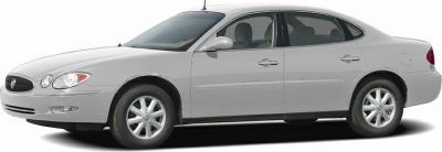 Side profile of a mid-2000s sedan with smooth lines and alloy wheels
