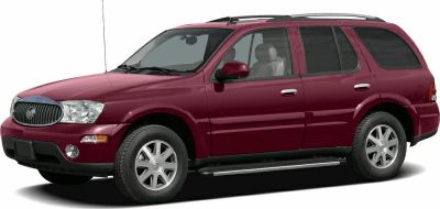 Mid-size SUV side profile with roof rails and running boards.