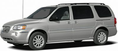 Silver minivan side view with sliding doors and roof rack