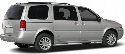 Silver minivan side profile with roof rails and alloy wheels