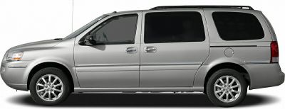 Silver minivan side profile with sliding doors and roof rack