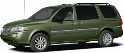 Side profile of a green minivan with sliding doors and alloy wheels