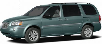 Side profile of a minivan with sliding doors and alloy wheels.