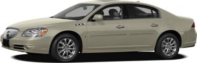 Side profile of beige luxury sedan with chrome wheels and side vents