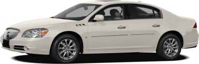 Side view with chrome wheels and vent details on white sedan
