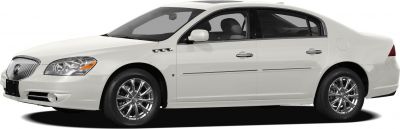 Side profile of a sedan with chrome rims and prominent fender vents