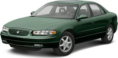 Green four-door sedan with sleek headlights and alloy wheels.
