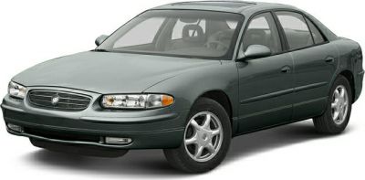 Front three-quarter view of a mid-size sedan with alloy wheels and classic styling