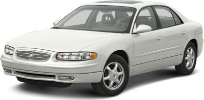 White sedan with chrome grille and clear headlights front side view