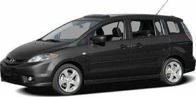 Side profile of a compact MPV showing sleek design and sliding rear doors.
