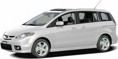 Side profile of a compact MPV with sliding rear doors and roof antenna