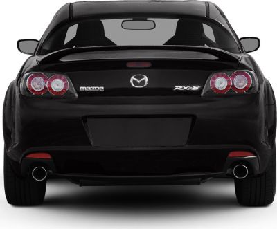 Rear view with circular taillights and dual exhaust pipes