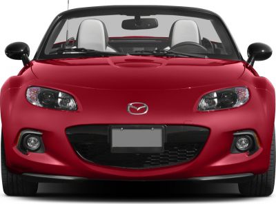 Close-up front view of red convertible with headlights and fog lamps