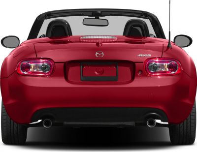 Rear view of a red convertible with dual exhaust and taillights.