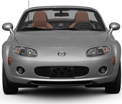 Front view of a silver convertible with distinctive headlights and grille