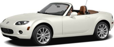 White convertible roadster with alloy wheels and brown leather interior