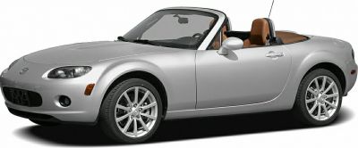 Silver Mazda MX-5 convertible side profile with alloy wheels