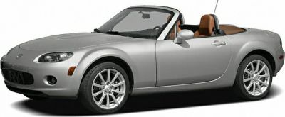 Silver convertible roadster with alloy wheels and soft top