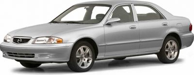 Silver four-door sedan front side with distinct headlights and alloy wheels