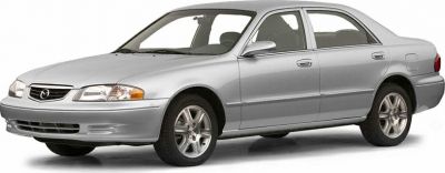 Silver four-door sedan with alloy wheels and classic front grille