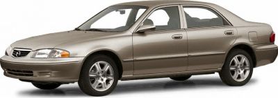 Beige four-door sedan side profile with alloy wheels