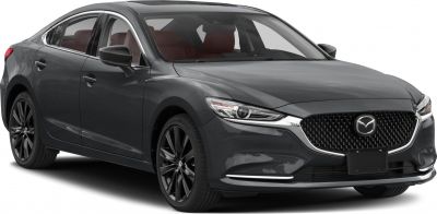 Front angle view of sedan with sleek headlights and black multi-spoke wheels