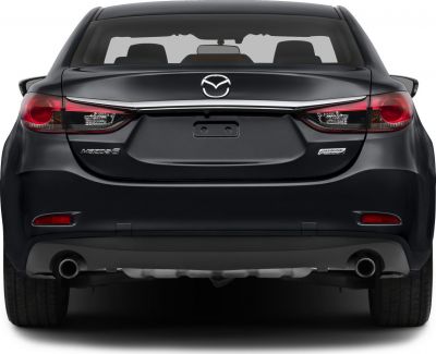 Rear view with sharp tail lights and dual exhaust pipes