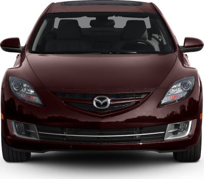 Front view of a car with sleek headlights and grille