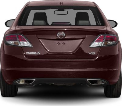 Rear view of sedan with V6 badge and dual exhausts