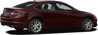 Rear side view of a mid-size sedan featuring alloy wheels and integrated exhaust.