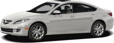White mid-size sedan with sleek aerodynamic design and alloy wheels