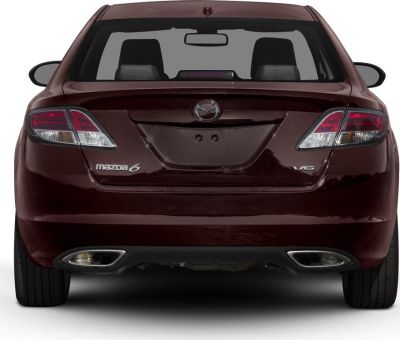 Rear view with distinctive tail lights and dual exhausts