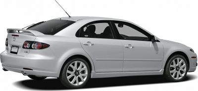 Rear side view of a hatchback with spoiler and distinct taillights