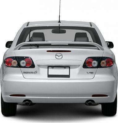 Rear hatchback view with spoiler and dual exhausts