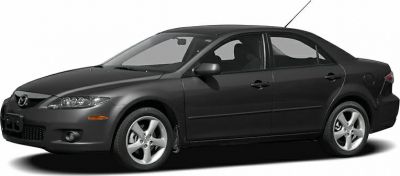 Dark gray sedan with alloy wheels and sleek body profile