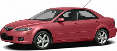 Side profile of a red sedan with alloy wheels