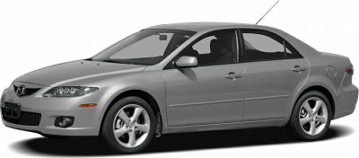 Silver mid-size sedan with sleek headlights and alloy wheels, front-side view