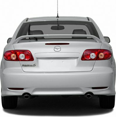 Rear view showing tail lights, spoiler, and dual exhausts on a hatchback