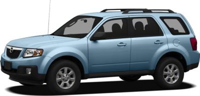 Side view of a light blue SUV with roof rails and alloy wheels