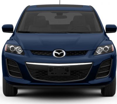 Front view with distinctive dual circular headlights and Mazda grille.