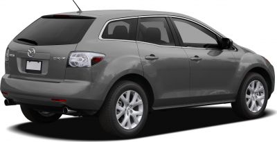Rear side view with dual exhaust and alloy wheels