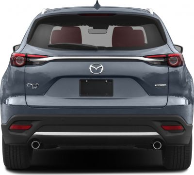 Rear view of SUV with dual exhausts, AWD and Skyactiv badges