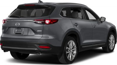 Rear and side view with taillights and dual exhausts of a modern SUV