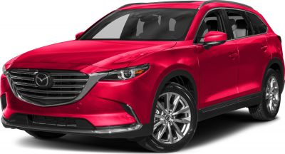 Red SUV with chrome grille, sleek headlights and alloy wheels